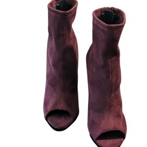 Burgundy suede ankle boots.